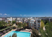 Thumbnail 14 of 30 - aerial exterior shot overlooking city and pool deck