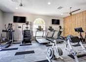 Thumbnail 11 of 38 - the gym has cardio equipment and treadmills in it
