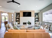 Thumbnail 4 of 38 - a living room with a couch and a tv