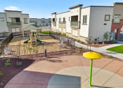 Thumbnail 33 of 36 - an empty playground in the middle of an apartment complex