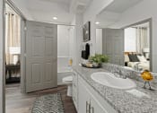 Thumbnail 11 of 36 - a bathroom with a sink and a toilet and a mirror