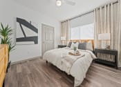 Thumbnail 7 of 36 - a bedroom with a large bed and a window