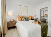 Thumbnail 9 of 36 - a bedroom with a bed and a tray of food on it