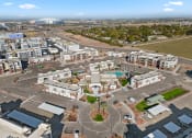 Thumbnail 15 of 36 - Aerial view of Cardinal 95 apartments in Glendale, AZ and city view including State Farm Stadium and Westgate District.