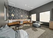 Thumbnail 27 of 36 - a lounge area with couches and chairs and a wall with a mural of skulls