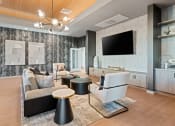 Thumbnail 30 of 36 - Contemporary resident lounge in neutral tones and natural light found at Cardinal 95 luxury apartments in Glendale, AZ.