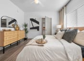 Thumbnail 1 of 36 - a bedroom with a large bed with white sheets and pillows
