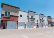 Thumbnail 35 of 36 - a row of townhomes in front of a parking lot