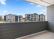 Thumbnail 17 of 50 - A view of apartment buildings from a balcony.