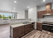 Thumbnail 30 of 50 - A modern kitchen with dark wood cabinets and stainless steel appliances.