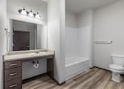 Thumbnail 36 of 50 - A bathroom with a sink, toilet, and bathtub.