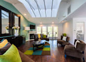Thumbnail 11 of 18 - A living room with a glass ceiling and a fireplace.