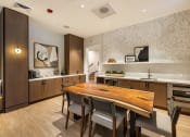 Thumbnail 6 of 32 - a kitchen and dining room with a wooden table