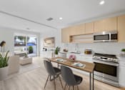 Thumbnail 58 of 58 - A modern kitchen with a dining table and chairs.