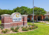 Thumbnail 33 of 33 - a brick sign with the words clear creek memories in front of a brick building