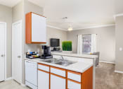 Thumbnail 10 of 33 - a kitchen with white cabinets and a white dishwasher