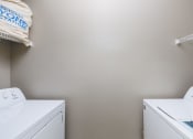 Thumbnail 13 of 33 - a washer and dryer in a laundry room