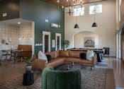 Thumbnail 25 of 34 - A living room with a pool table and a green couch.