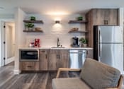 Thumbnail 11 of 33 - a kitchen with stainless steel appliances and a stainless steel refrigerator