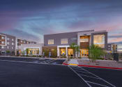 Thumbnail 52 of 59 - a parking lot in front of an apartment building at sunset at Element 12 Apartments, Henderson NV