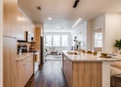 Thumbnail 2 of 28 - a kitchen with a counter top and a sink