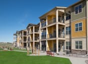Thumbnail 10 of 26 - apartments building exterior with balcony and walk way