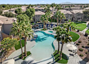 Thumbnail 37 of 52 - an aerial view of a swimming pool with palm trees