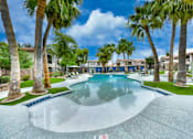 Thumbnail 48 of 52 - A swimming pool surrounded by palm trees and a no swimming sign.