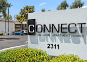 Thumbnail 21 of 21 - A white sign with black lettering that says Connect Union Apartment Homes 2311.