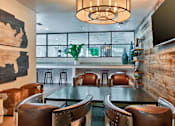 Thumbnail 17 of 21 - a dining room with a table and chairs