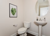 Thumbnail 7 of 60 - a small bathroom with a toilet sink and mirror