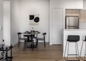 Thumbnail 4 of 27 - A modern dining area with a black table and chairs at The Arvon, Vancouver, WA