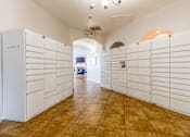 Thumbnail 33 of 34 - a bunch of white lockers in a room with a tile floor