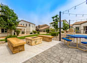 Thumbnail 9 of 34 - the backyard has a picnic table and benches and a fire pit