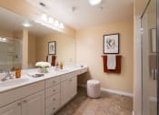 Thumbnail 23 of 30 - a large bathroom with two sinks and a shower
