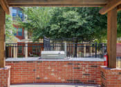 Thumbnail 22 of 35 - a brick wall with a grill on top of it