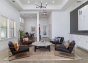 Thumbnail 3 of 35 - a living room with white walls and a coffered ceiling