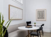 Thumbnail 6 of 35 - a seating area with a sofa table and two chairs