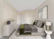 Thumbnail 5 of 21 - a bedroom with a bed and a dresser and a bathroom