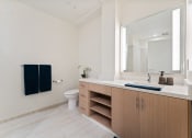 Thumbnail 12 of 54 - a bathroom with a sink and a toilet and a mirror