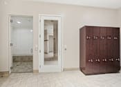 Thumbnail 47 of 57 - A white tiled floor and a brown cabinet with four doors are visible in the image.