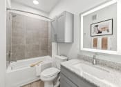 Thumbnail 10 of 50 - a bathroom with a sink toilet and a bath tub