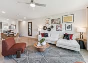 Thumbnail 4 of 50 - a living room with a couch and a table