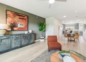 Thumbnail 5 of 50 - a living room and dining room with a table and chairs
