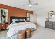 Thumbnail 21 of 50 - a bedroom with a bed and a ceiling fan