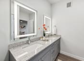Thumbnail 24 of 50 - a bathroom with two sinks and a large mirror