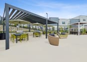 Thumbnail 44 of 50 - a rendering of a patio with tables and chairs at a building