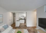 Thumbnail 7 of 25 - the living room and kitchen of an apartment with a couch and a tv