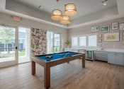 Thumbnail 28 of 59 - a game room with a pool table and a window
