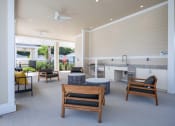 Thumbnail 35 of 59 - a patio with a table and chairs and a kitchen
